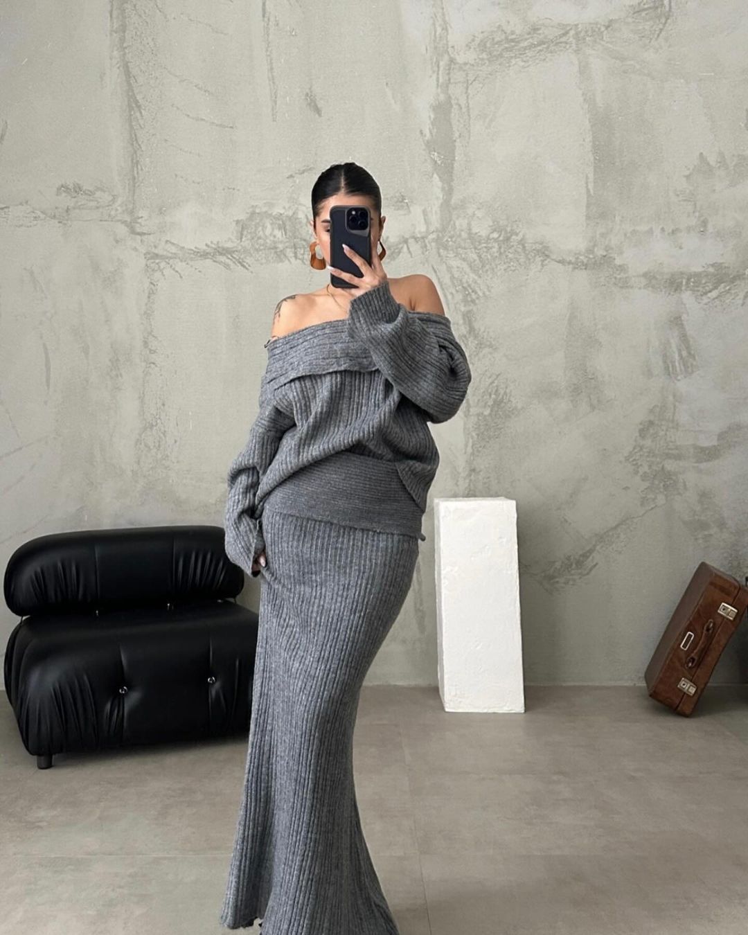 Gray off-shoulder ribbed knit sweater with matching long knit skirt set