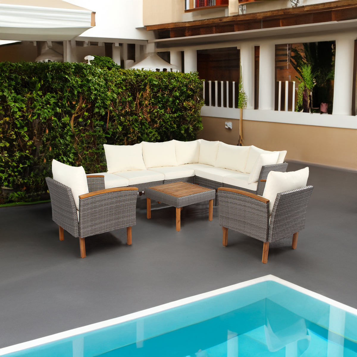 Gray wicker patio conversation set with white seat and back cushions