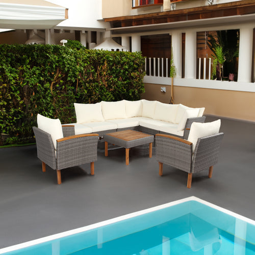 Gray wicker patio conversation set with white seat and back cushions