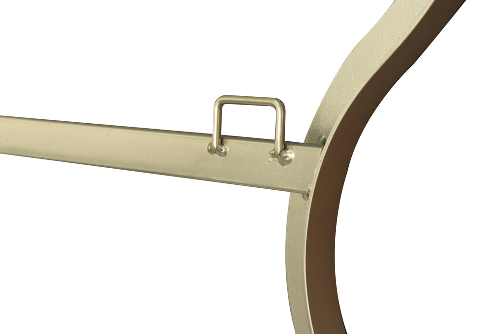 Gold wall mirror frame detail with hanging loop and wavy edge