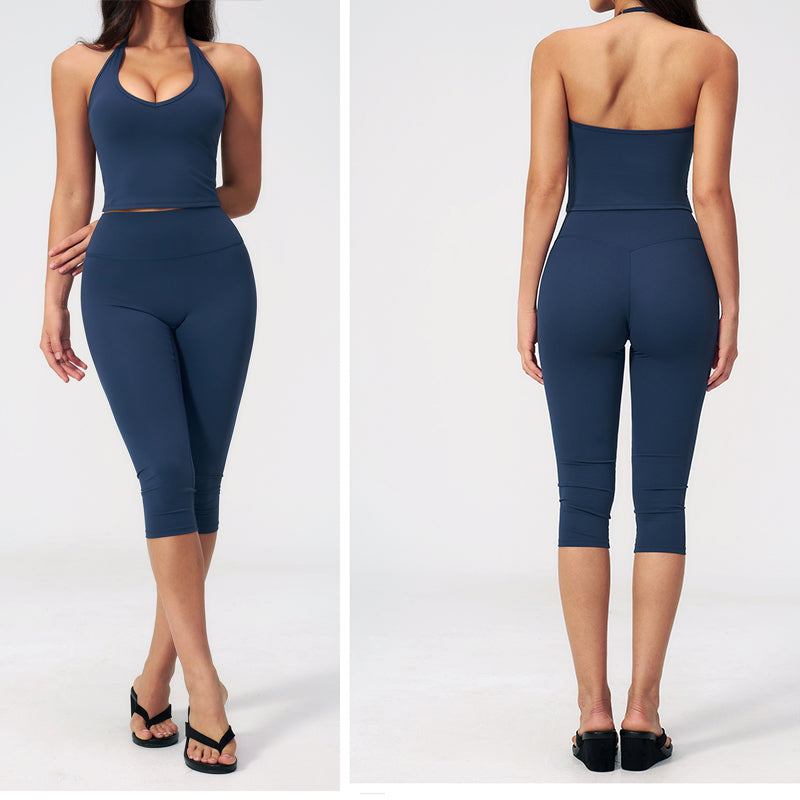 Women’s sports vest suit in badge blue: crop top and capri leggings, front and back view.