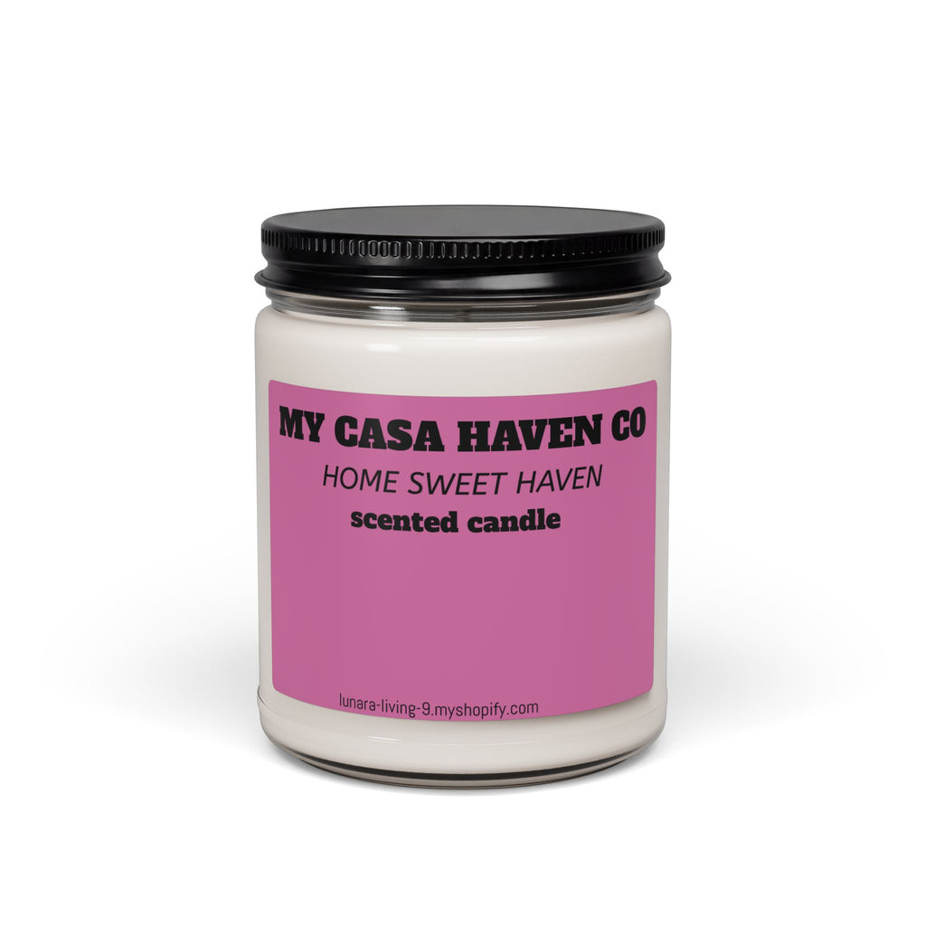 Scented soy candle in clear glass jar with black screw lid, purple label