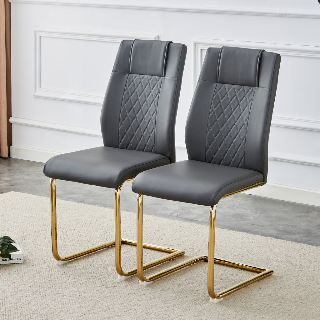 Gray faux leather accent chair with quilted back, cushioned seat, gold metal legs
