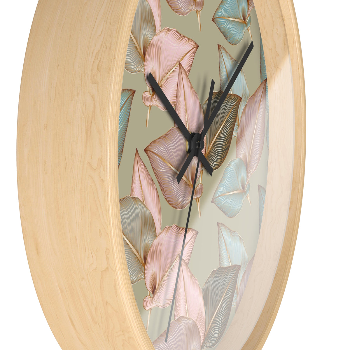 Wood wall clock close-up: round wooden frame with leaf dial and black hands