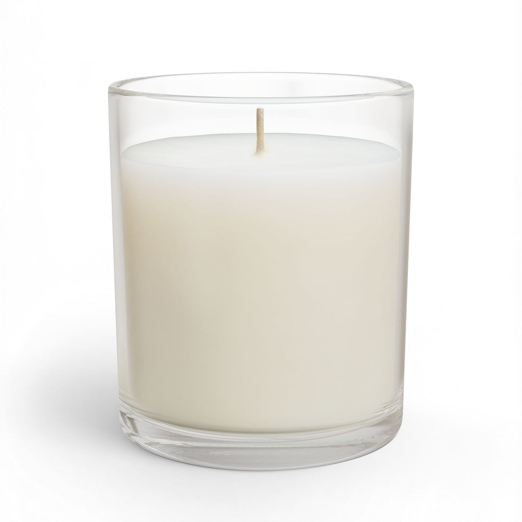 Glass candle in clear jar with creamy white wax and lit wick, smooth front