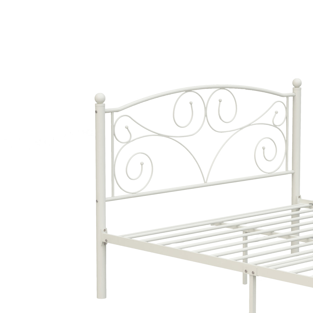 White metal bed frame close-up of scroll headboard and wire slatted lower rail