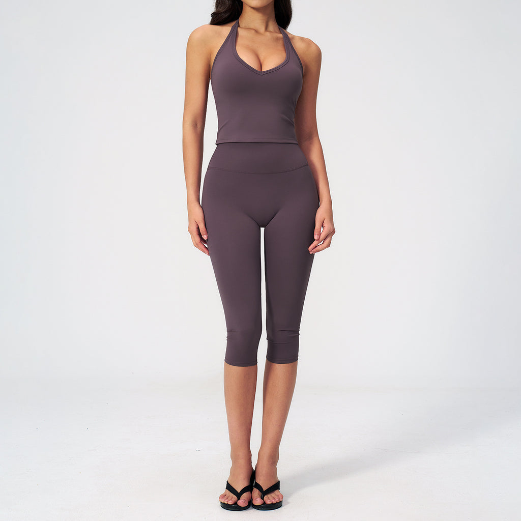 Women’s sports vest suit in aubergine purple: front view sleeveless crop top and capris.