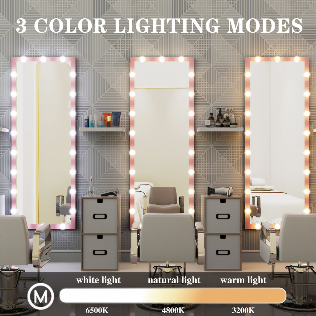 Three pink Hollywood mirrors with illuminated bulb frames and bedside furniture