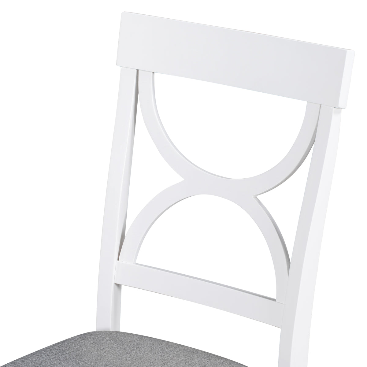 White dining chair with scalloped back design, showing gray upholstered seat edge