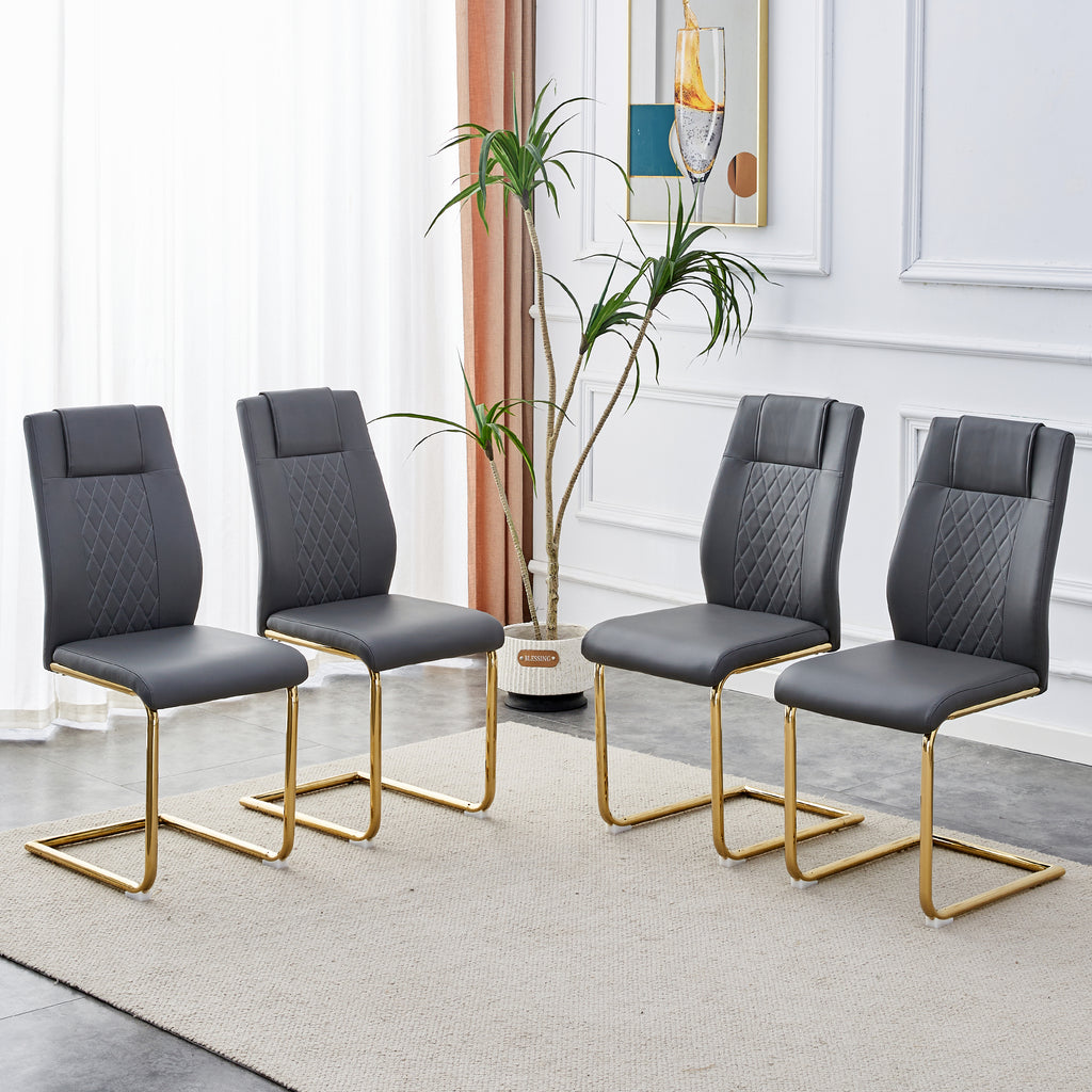 Group of gray faux leather dining chairs with quilted backs, cushioned seats, and gold frames.