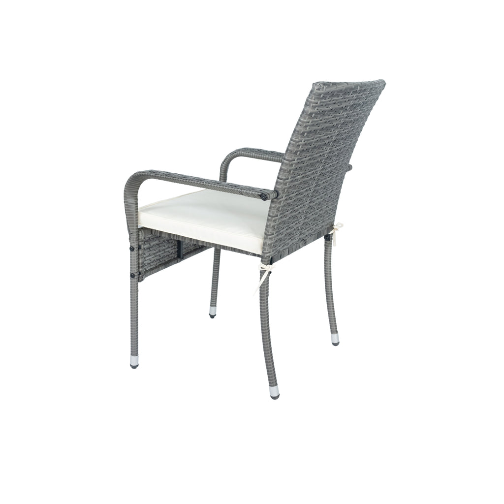 Grey wicker patio armchair with white cushion and arched armrests, standalone view.