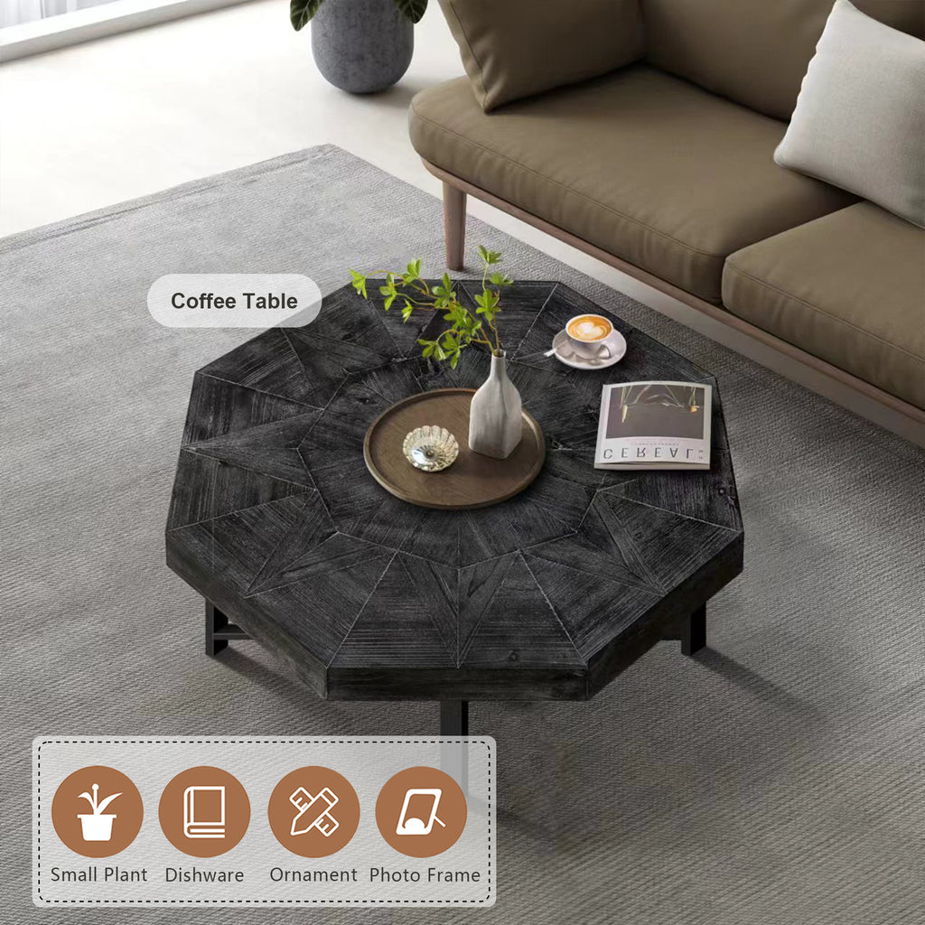 Antique black octagonal coffee table with textured tabletop and metal X-frame legs