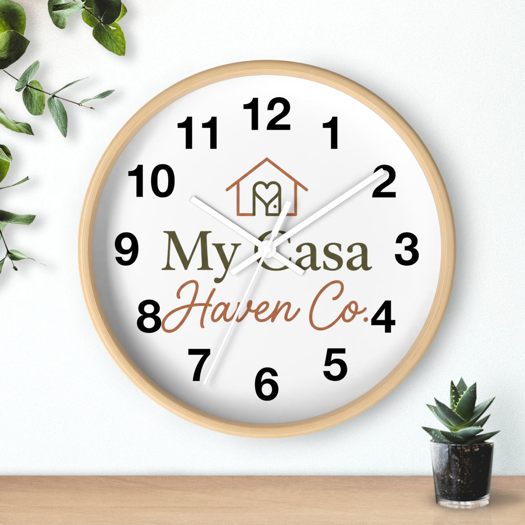 Wood wall clock with light wood frame, bold black numerals, white hands on white face