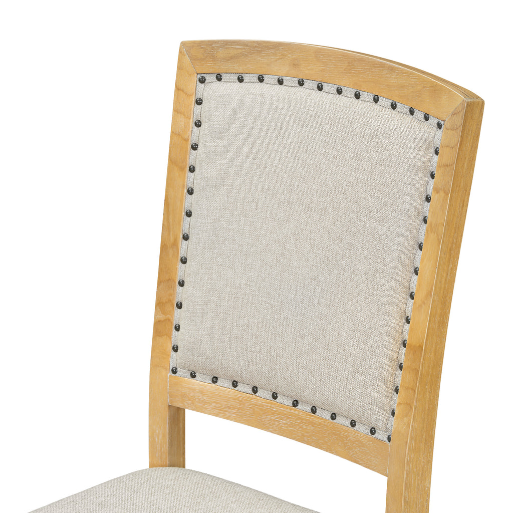 Natural wood dining chair with beige upholstered back and nailhead trim