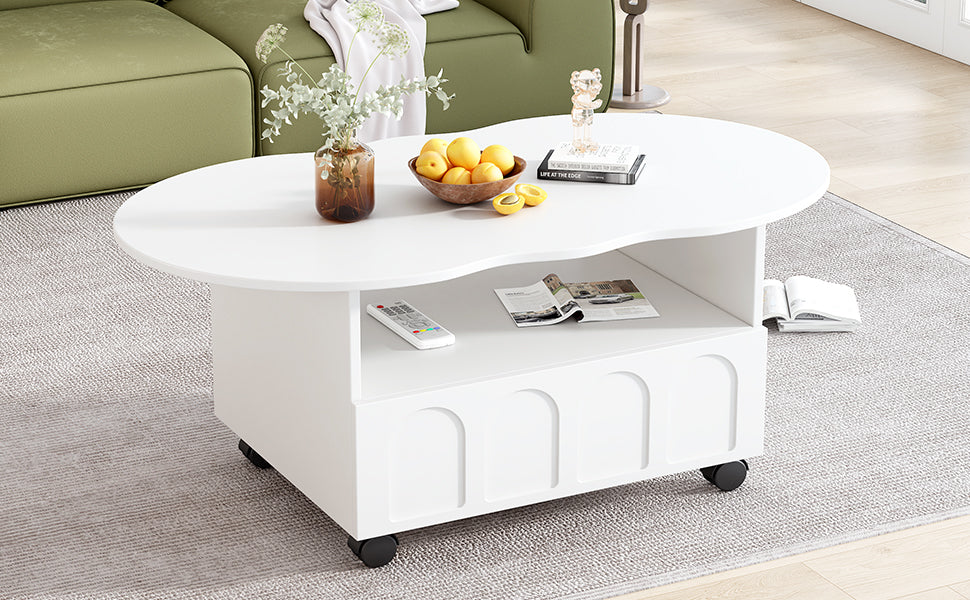 White round coffee table with open shelf and drawer, caster wheels; fruit and magazines on top