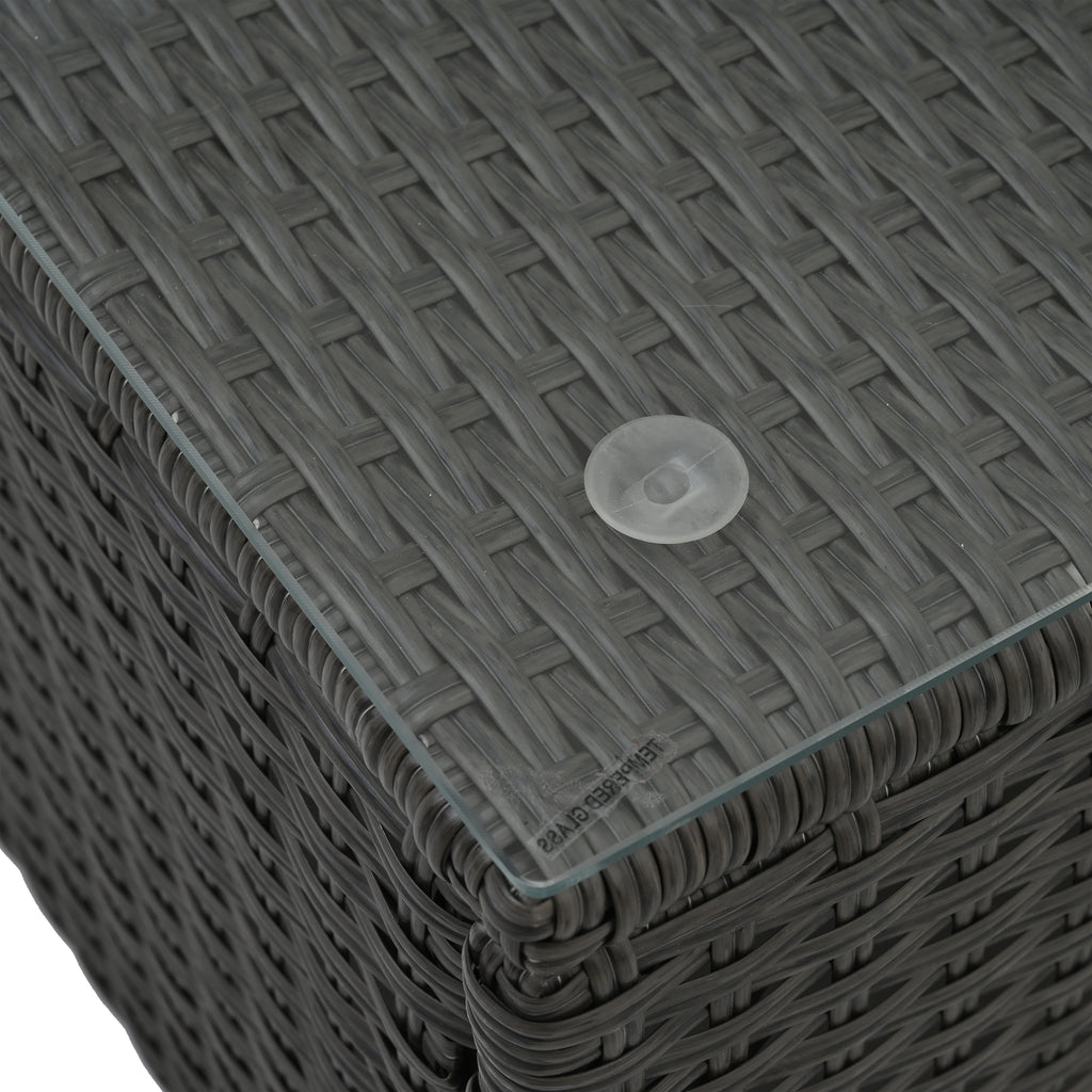 Close-up of dark gray woven ottoman with corner detail and clear protective cap