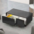 Black smart coffee table with open refrigerated compartment and two drawer-style fronts