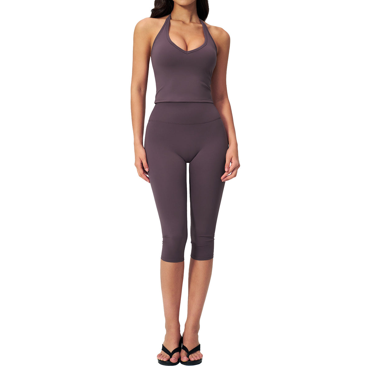 Women’s sports vest suit in aubergine purple: front view crop top and capri leggings.