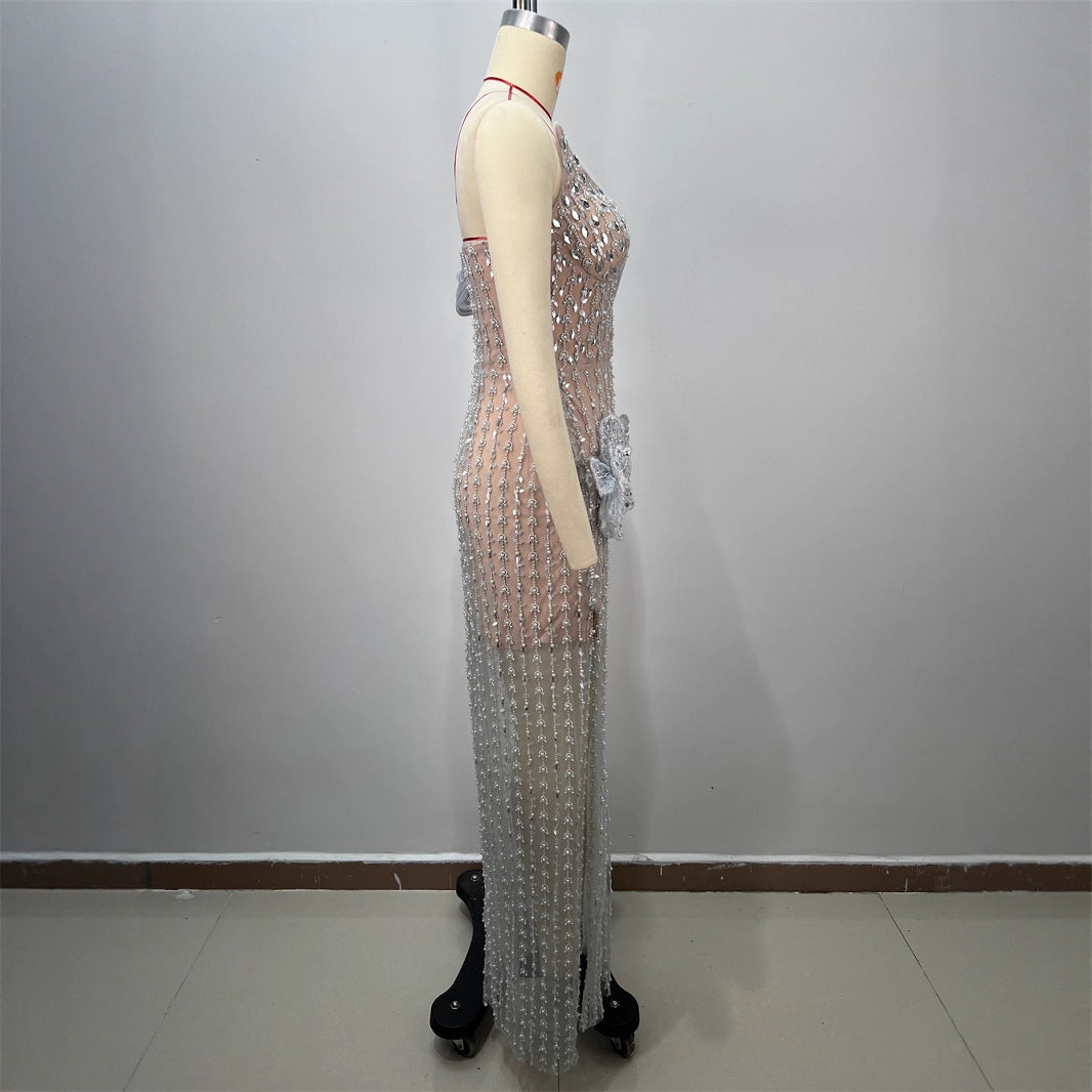 Silver sequined strapless floor-length dress with draped tulle sleeve