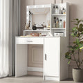 White makeup vanity desk with lighted mirror, drawer, and enclosed storage cabinet