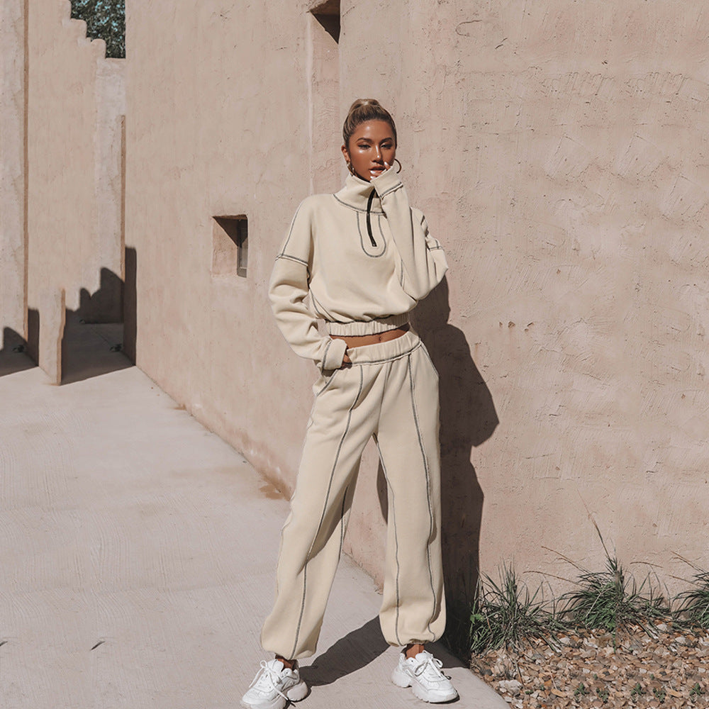 Beige sports hoodie and jogger set with half-zip mock neck, elastic waistband and cuffs