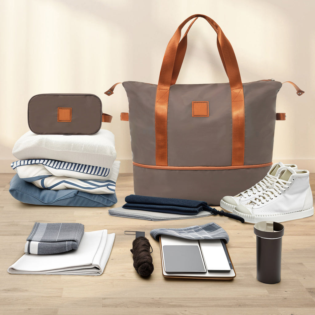 3-piece luggage set with coppery duffel bag, gray duffel, and packed travel essentials