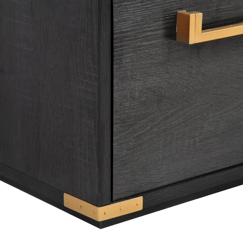 Black desk corner with gold metal trim along the base and side panel.
