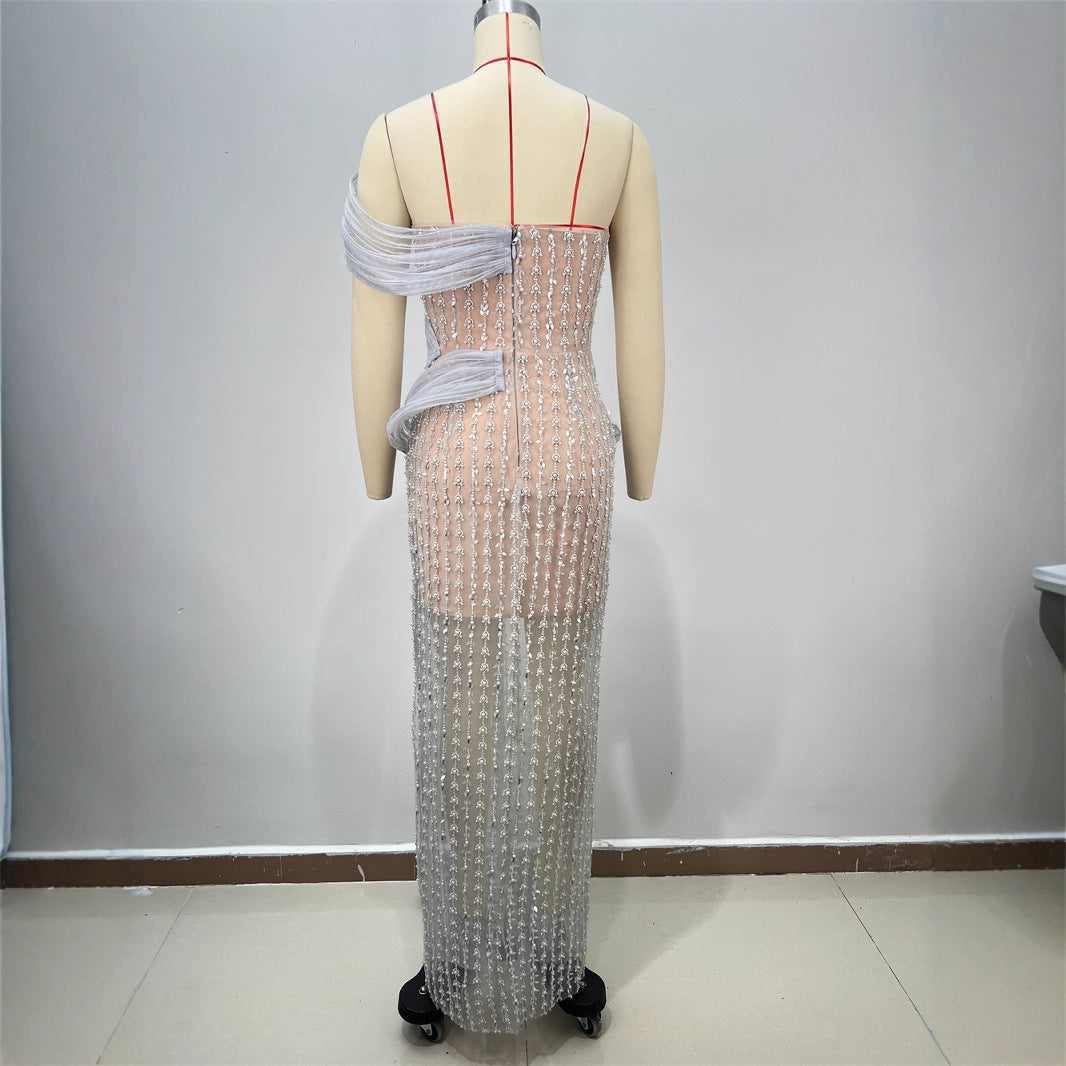 Silver sequined strapless backless-style evening dress with draped tulle sleeve