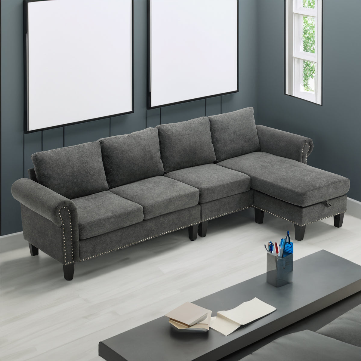 Gray L-shaped sectional sofa with tufted side accents and chaise-style ottoman