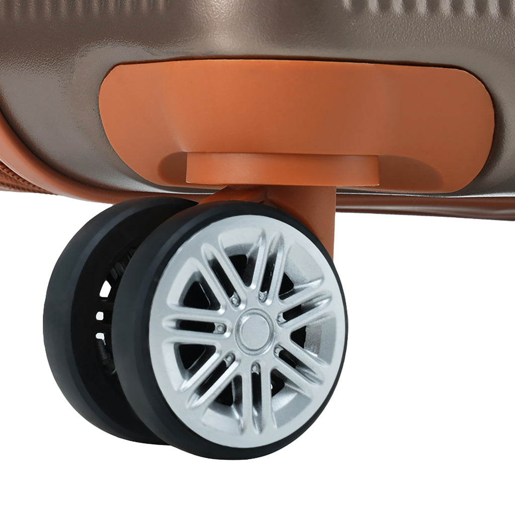 Coppery hard-shell suitcase wheel with dual spinners and silver hub