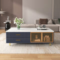 Navy coffee table with glass-door front panel, gold accents, and short gold legs