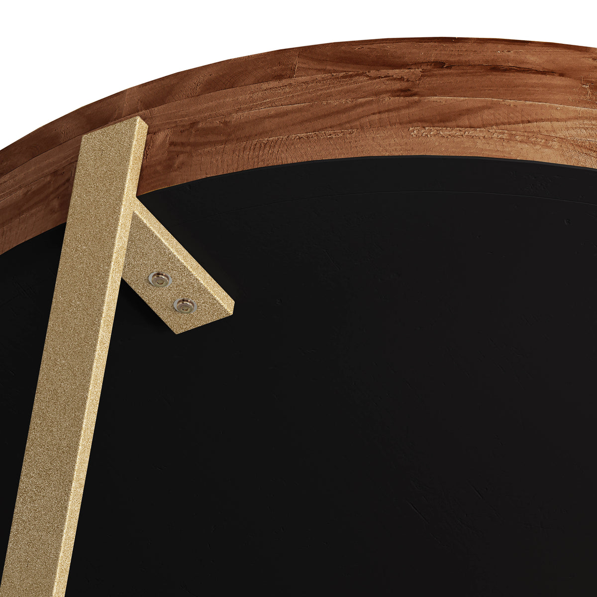 Close-up of round fir wood coffee table corner with gold-toned cross leg