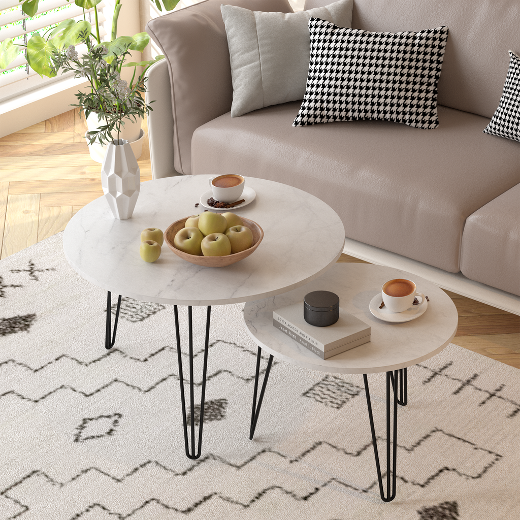 Round nesting coffee table set of 2 with white tops and black tapered metal legs