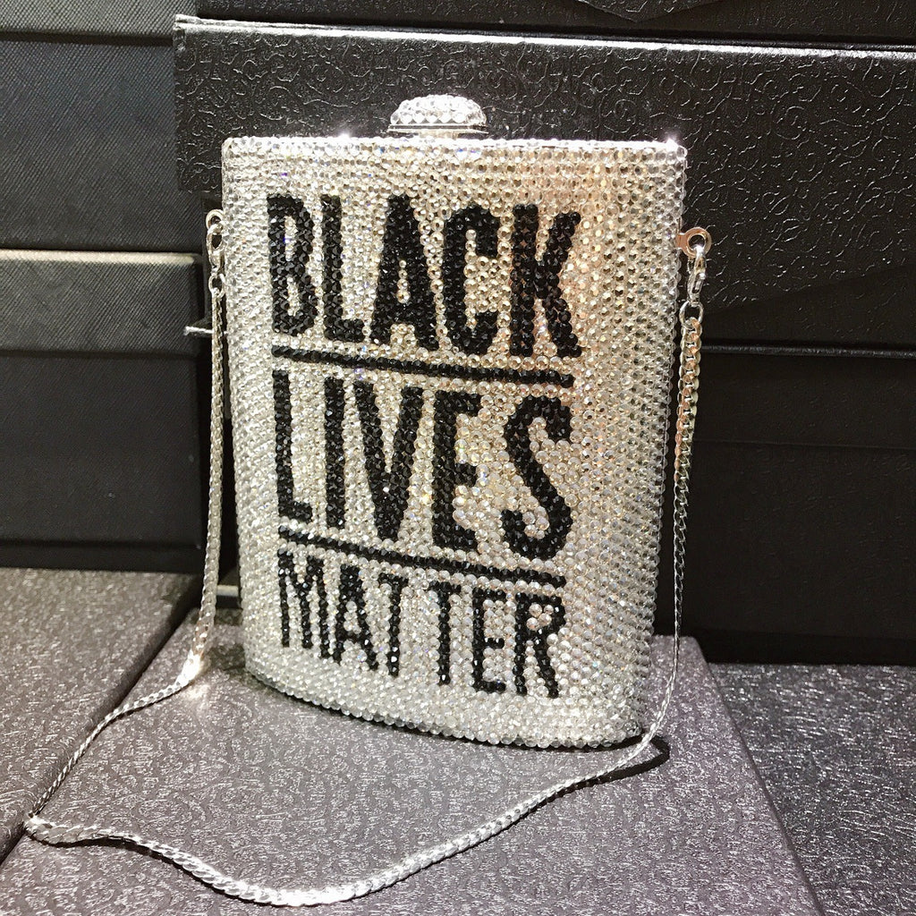 Silver rhinestone crossbody bag with chain, front text “BLACK LIVES MATTER”