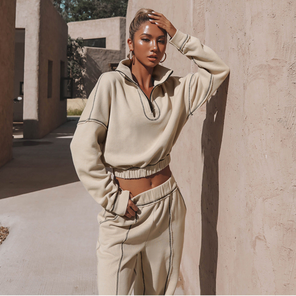 Beige quarter-zip cropped hoodie with elastic hem and matching track pants set