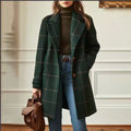 Dark green plaid wool coat with tailored fit, notched collar, and flap pockets