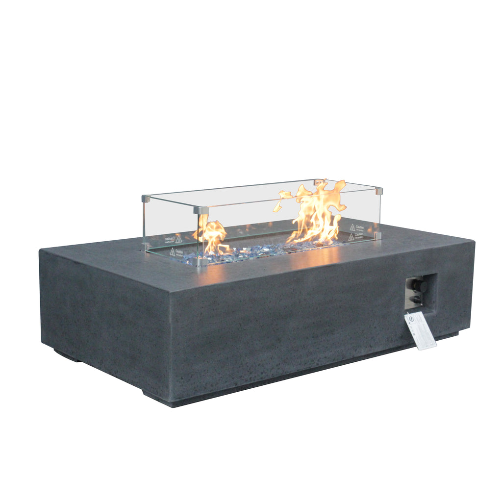 Dark gray rectangular outdoor propane fire pit table with glass wind guard and tall flames