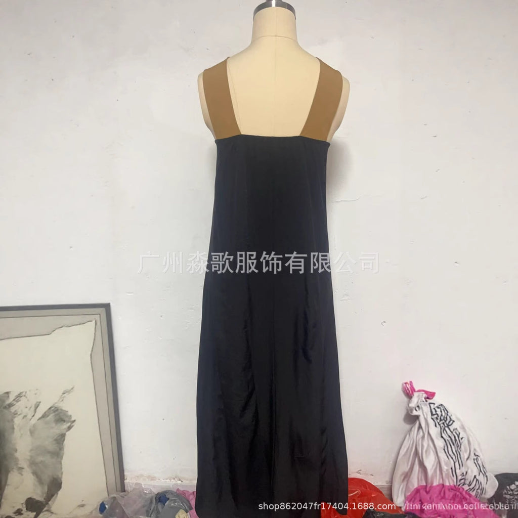 Black sleeveless cross-strap maxi dress on mannequin, V back with crisscross straps