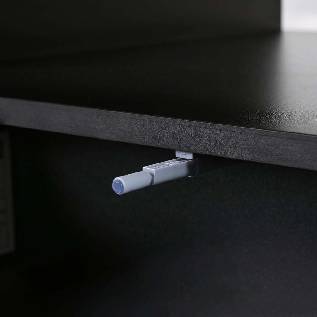 Drawer hinge mechanism under black coffee table cabinet, with push rod detail