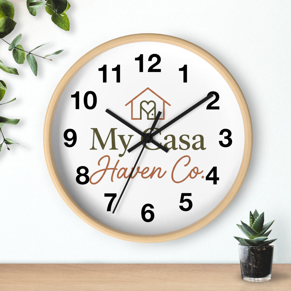 Wood wall clock with light wood frame, bold black numerals, black hands on white face
