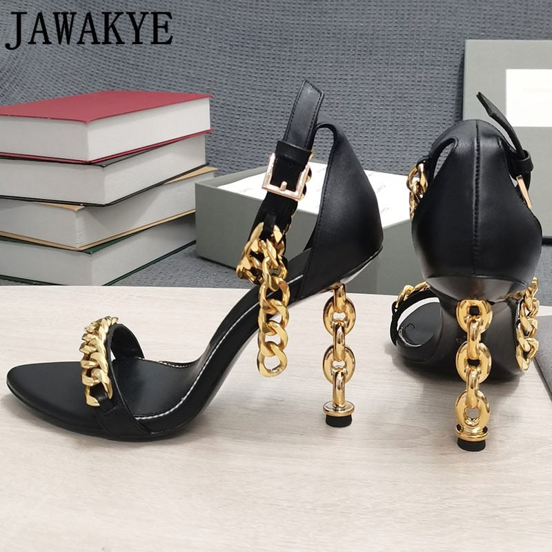 Side view of black high-heel sandal with gold chain ankle strap and ankle buckle