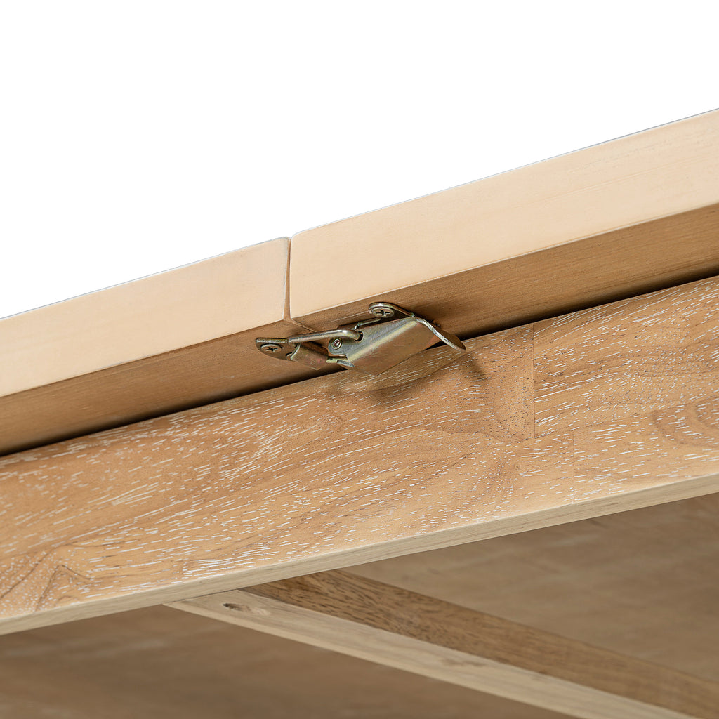 Expandable dining table leaf hardware detail on natural wood tabletop