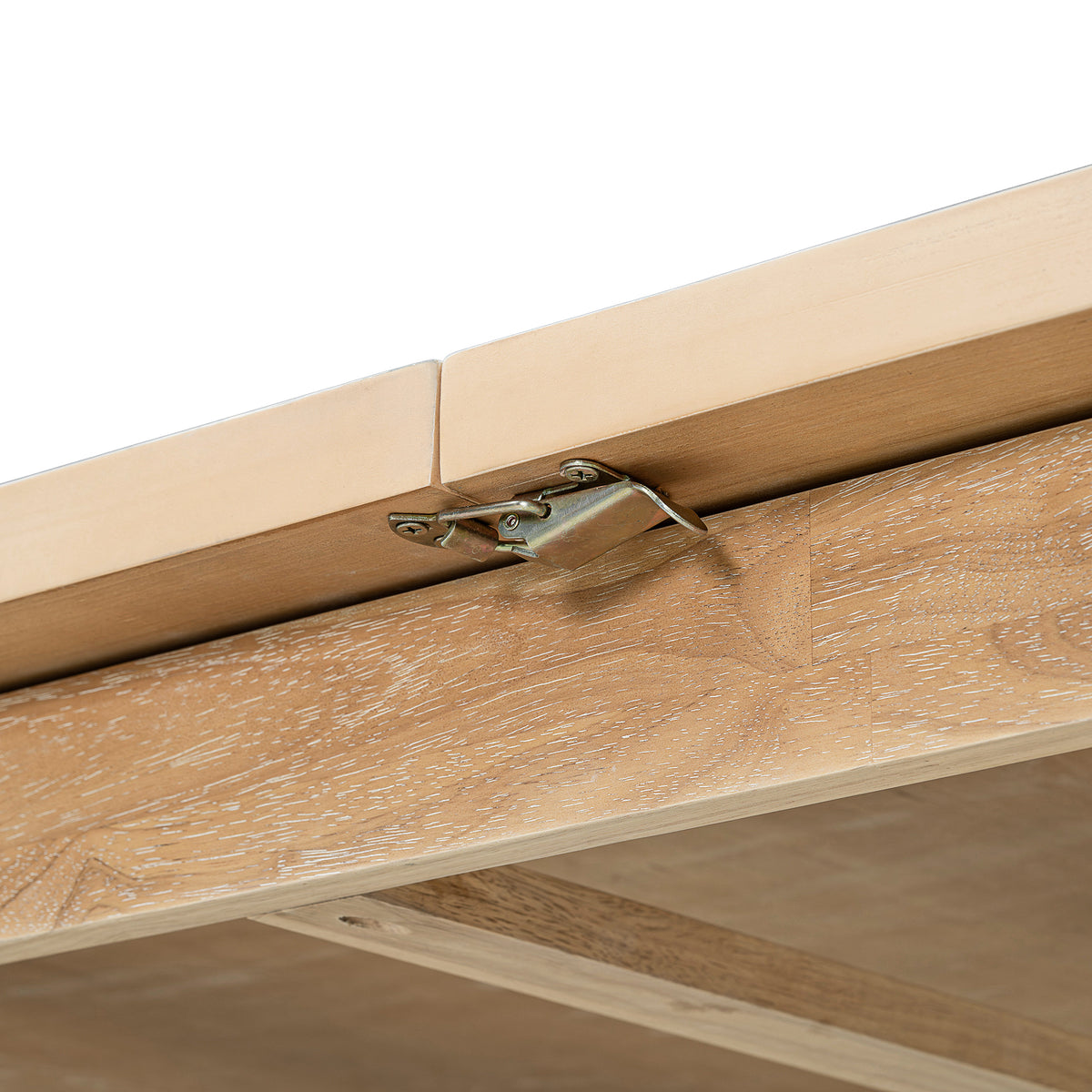 Expandable dining table leaf hardware detail on natural wood tabletop