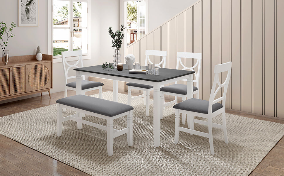 Farmhouse dining table with white frame, gray top, and gray upholstered seating set