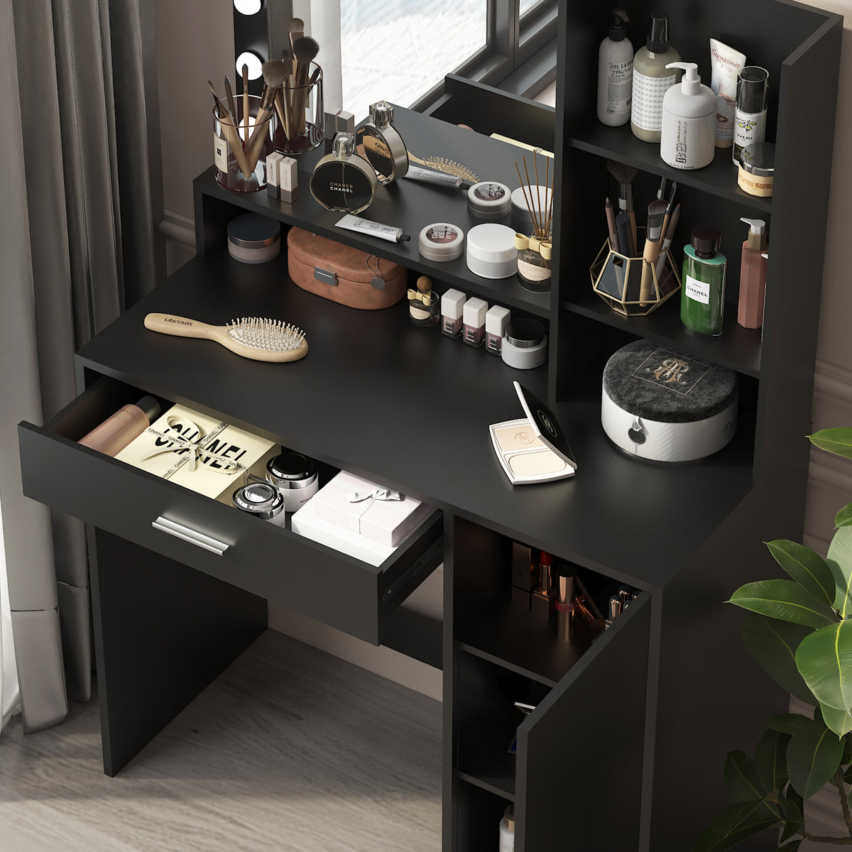Black makeup vanity desk with open drawers and shelves holding skincare and makeup accessories