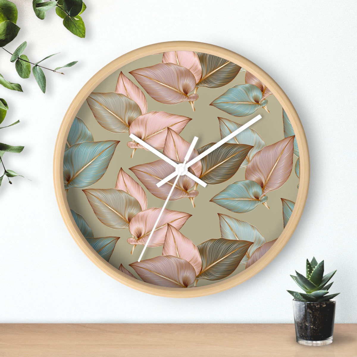 Round wood wall clock with pastel leaf dial and white clock hands