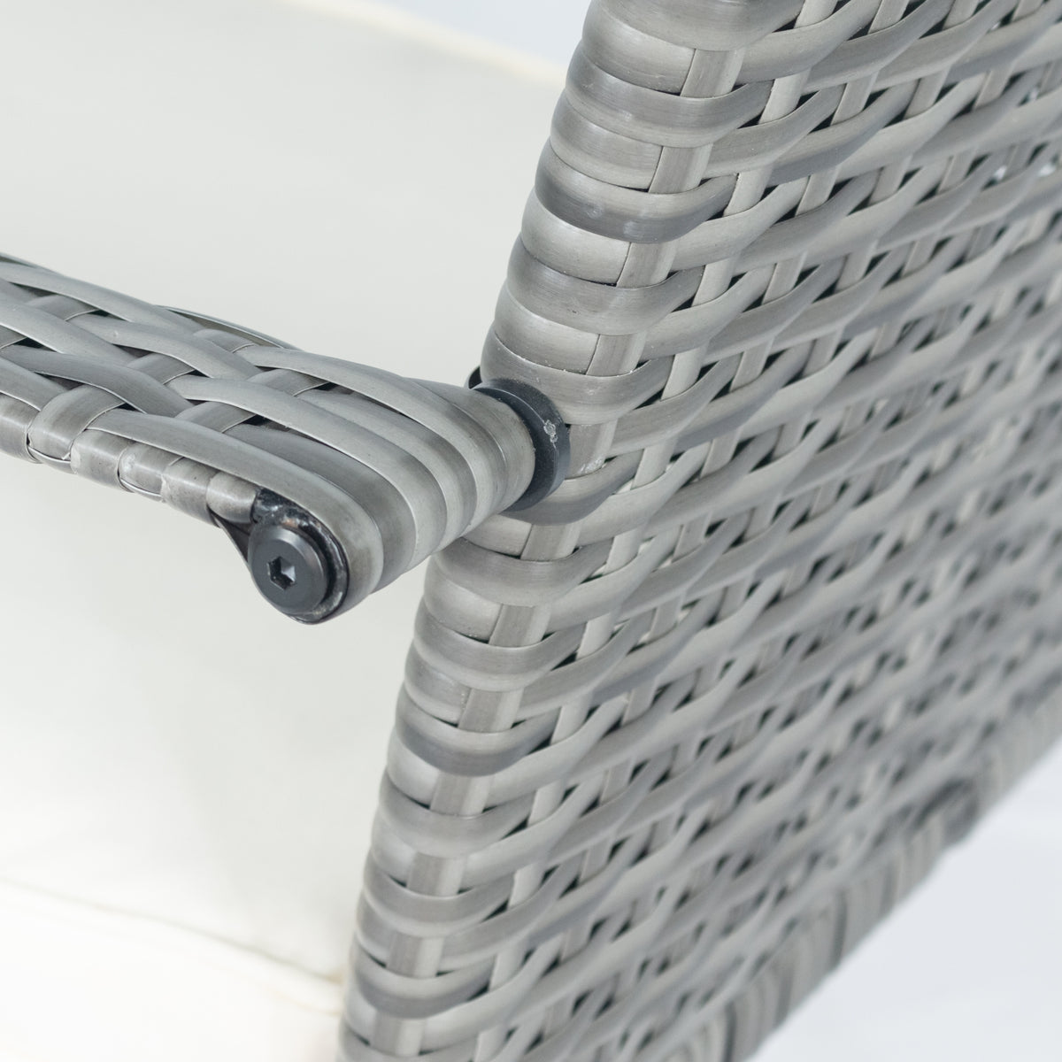 Gray wicker armrest corner with metal fastener