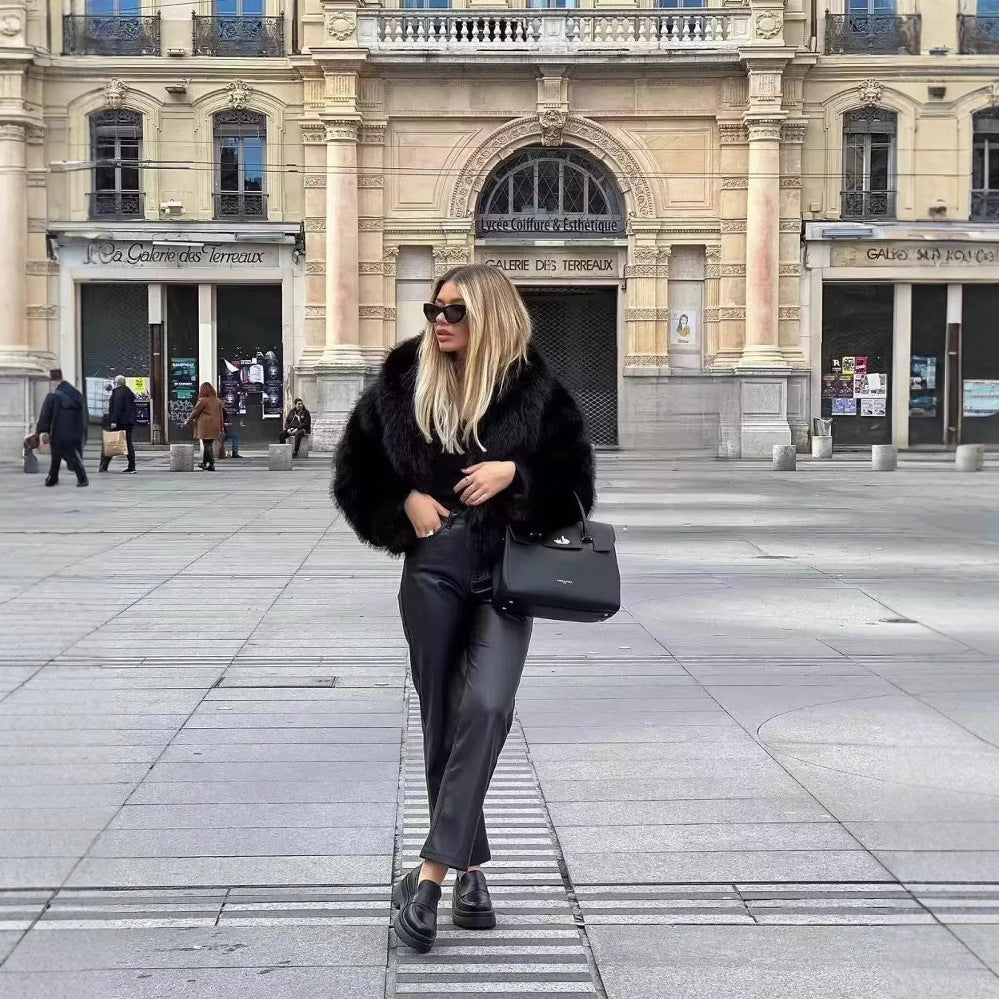 Black faux fur jacket with wide collar and long sleeves, open front