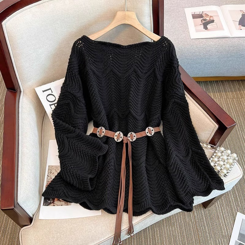 Women’s black one-shoulder knit sweater with textured pattern and tassel tie belt