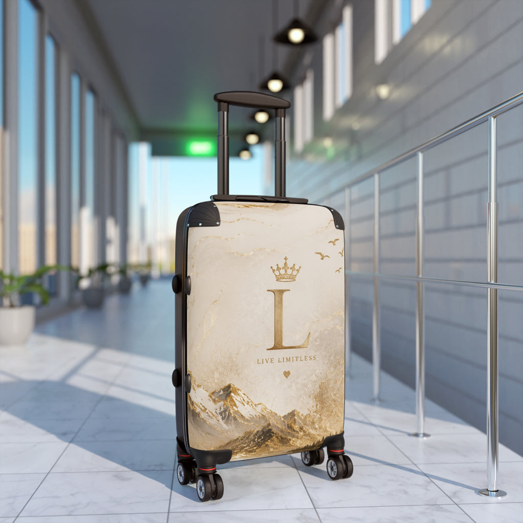 Cream suitcase with gold landscape and 'L' emblem, telescopic handle, four spinner wheels